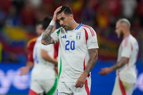 Italy's Mattia Zaccagni reacts after the match